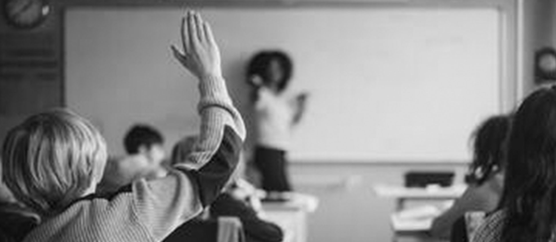 Classroom with student raising hand