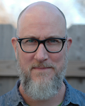 Photograph of man with glasses and beard