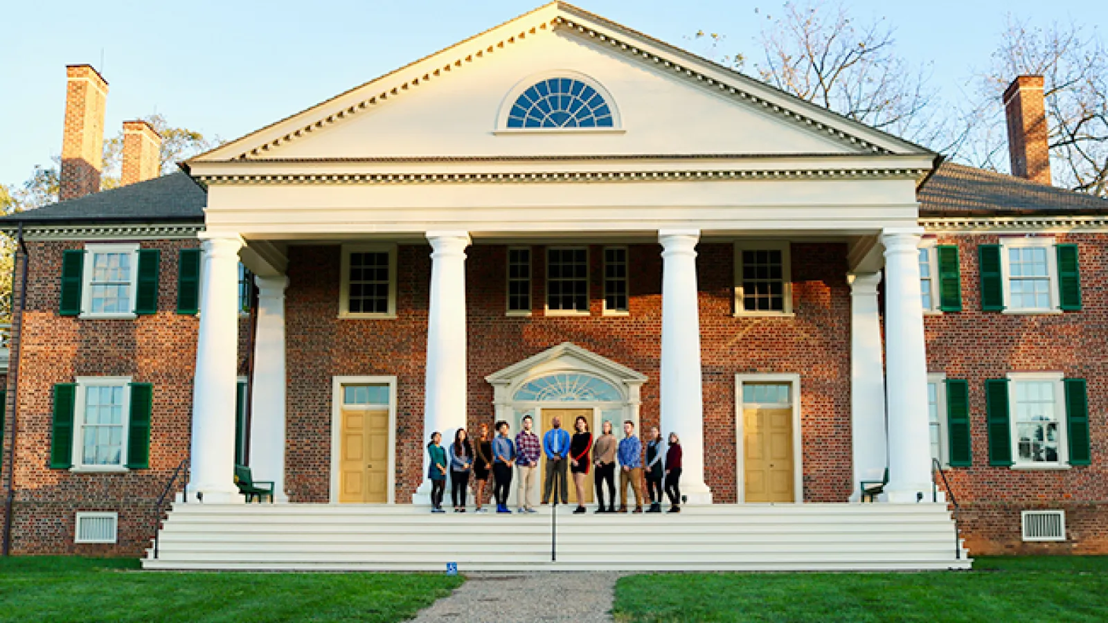 Student group and professor at entrance of Montepelier