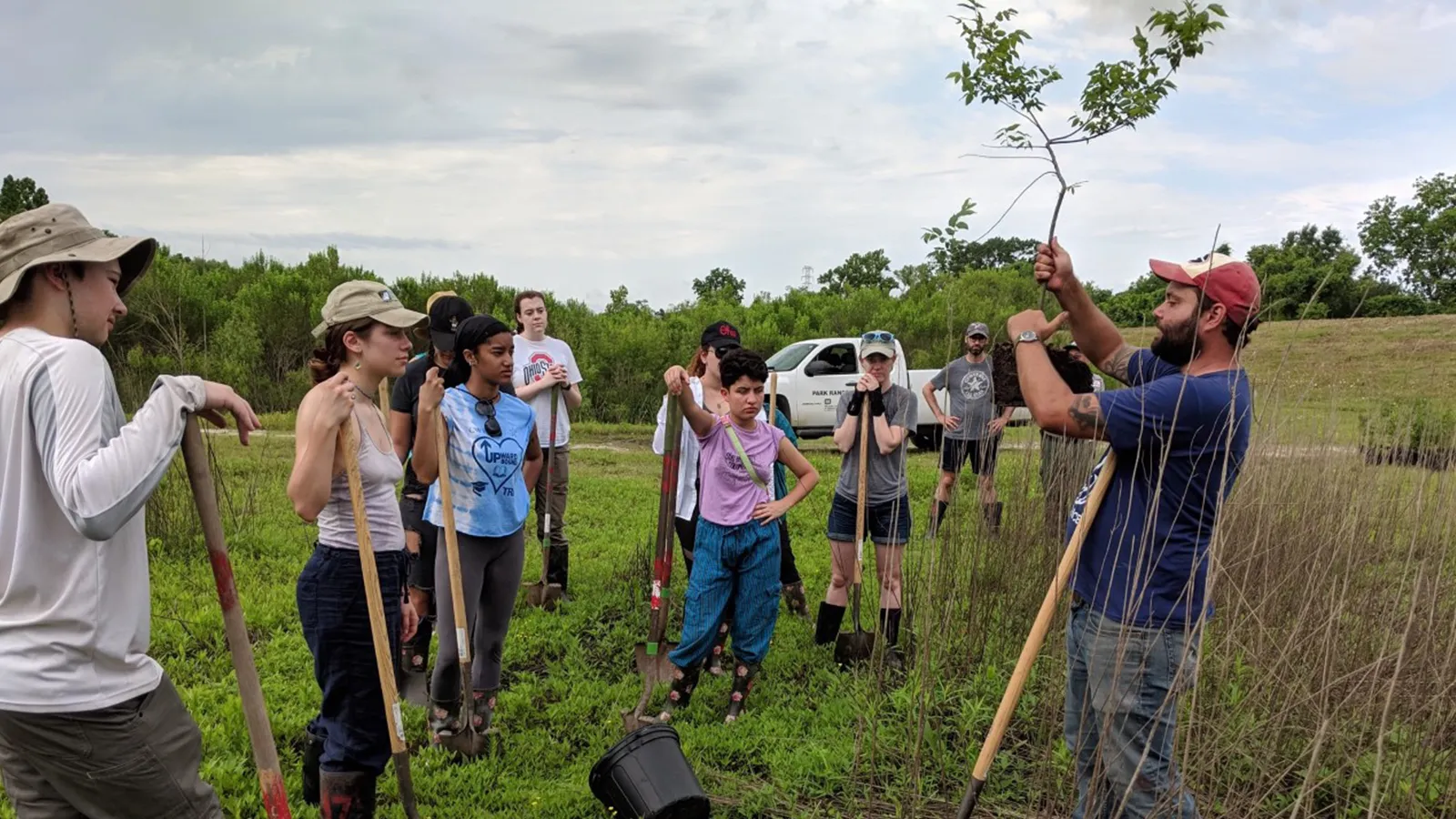 Field school students listen to planting instructions