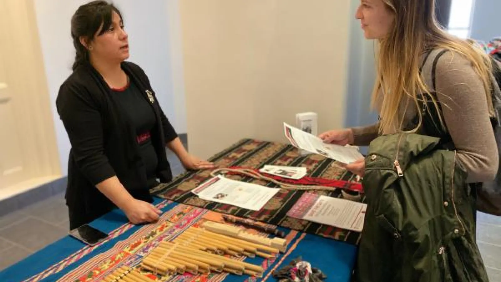 Elvia speaking with a student
