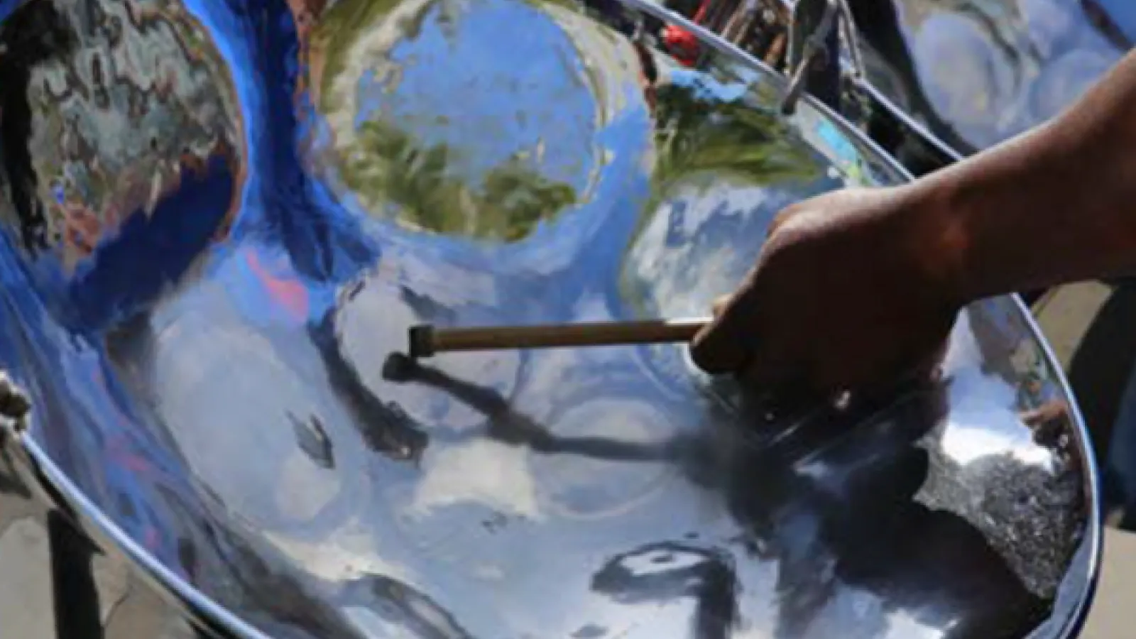 Someone playing a steel drum