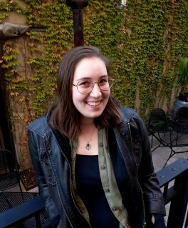 Smiling young woman in a leather jacket