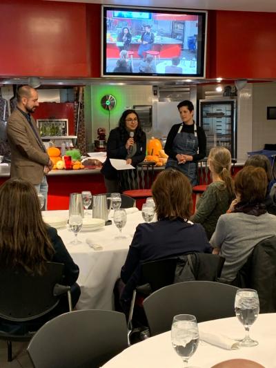 Photograph of Chef Morales speaking to event audience