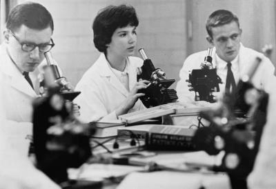 Two men and a woman in a science lab