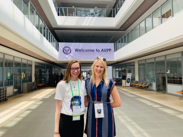   The author and her mentor, Dr. Hollie Nyseth Brehm, at the 14th Conference of the International Association of Genocide Scholars at the American University of Phnom Penh