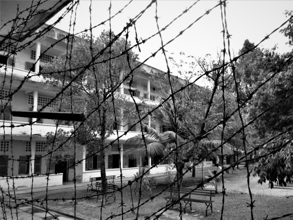 Visitors can step inside barbed wire covering the façade of a building at Tuol Sleng and look out. This creates an immediate sense of claustrophobia, simulating what the prisoners might have experienced here.