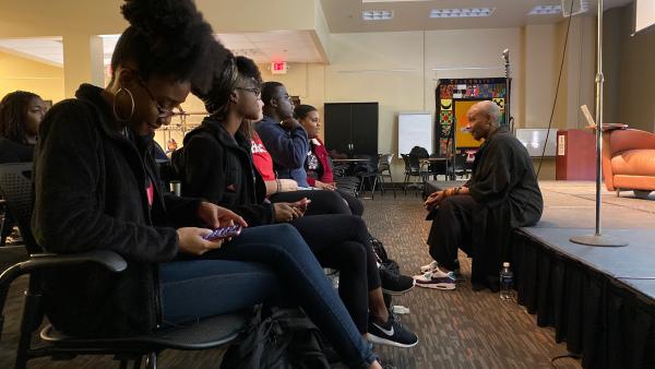 Josette Bushell-Mingo speaks with students in audience before the show