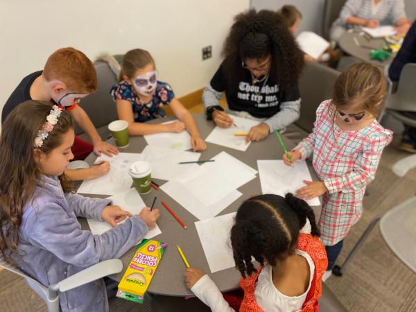 Photograph of children participating in a comics lesson