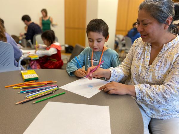 Family members participating in the comics lesson