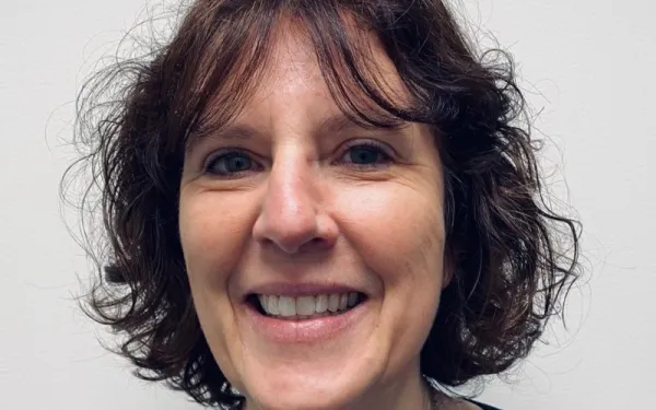 a smiling woman, Anna Travis