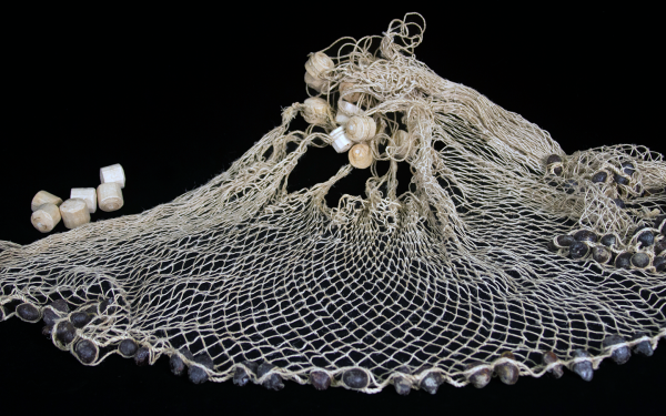 Atarraya fishing net from Pacayacu, Ecuador, made with black bees-wax (pungara)-coated stones and considered among the finest in Amazonia. Acquired from maker