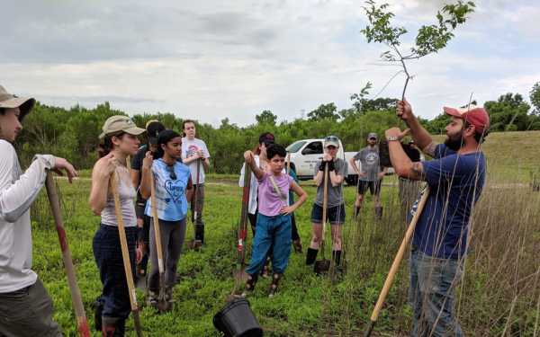 Field school students listen to planting instructions