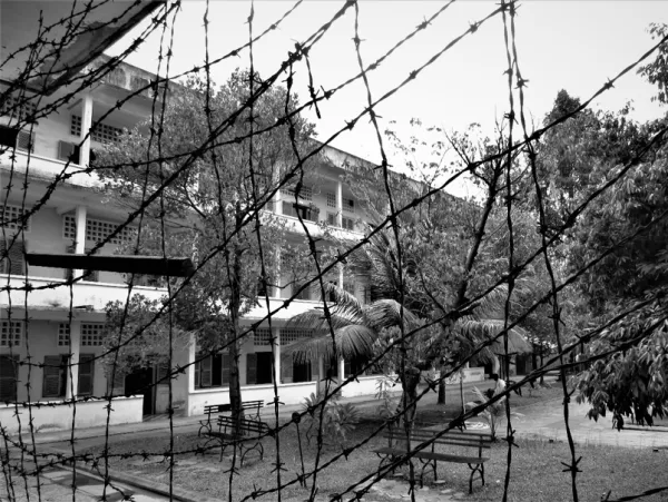 Barbed wire fence in front of building