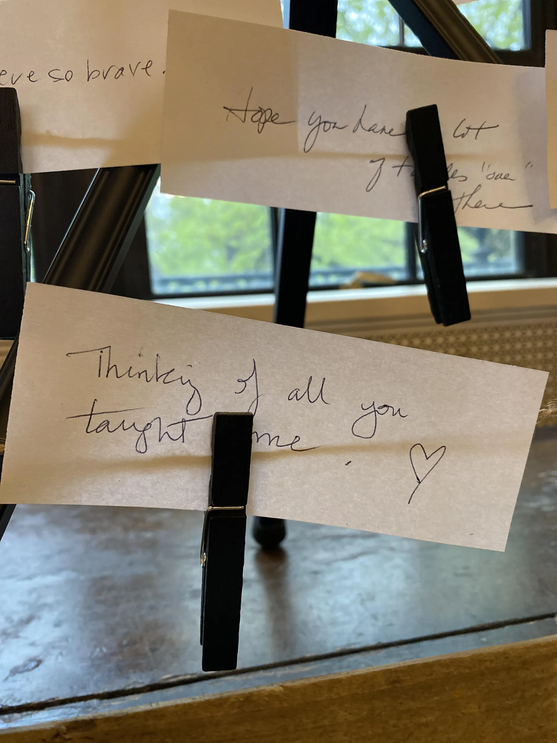 Closeup of handwritten notes pinned to the altar