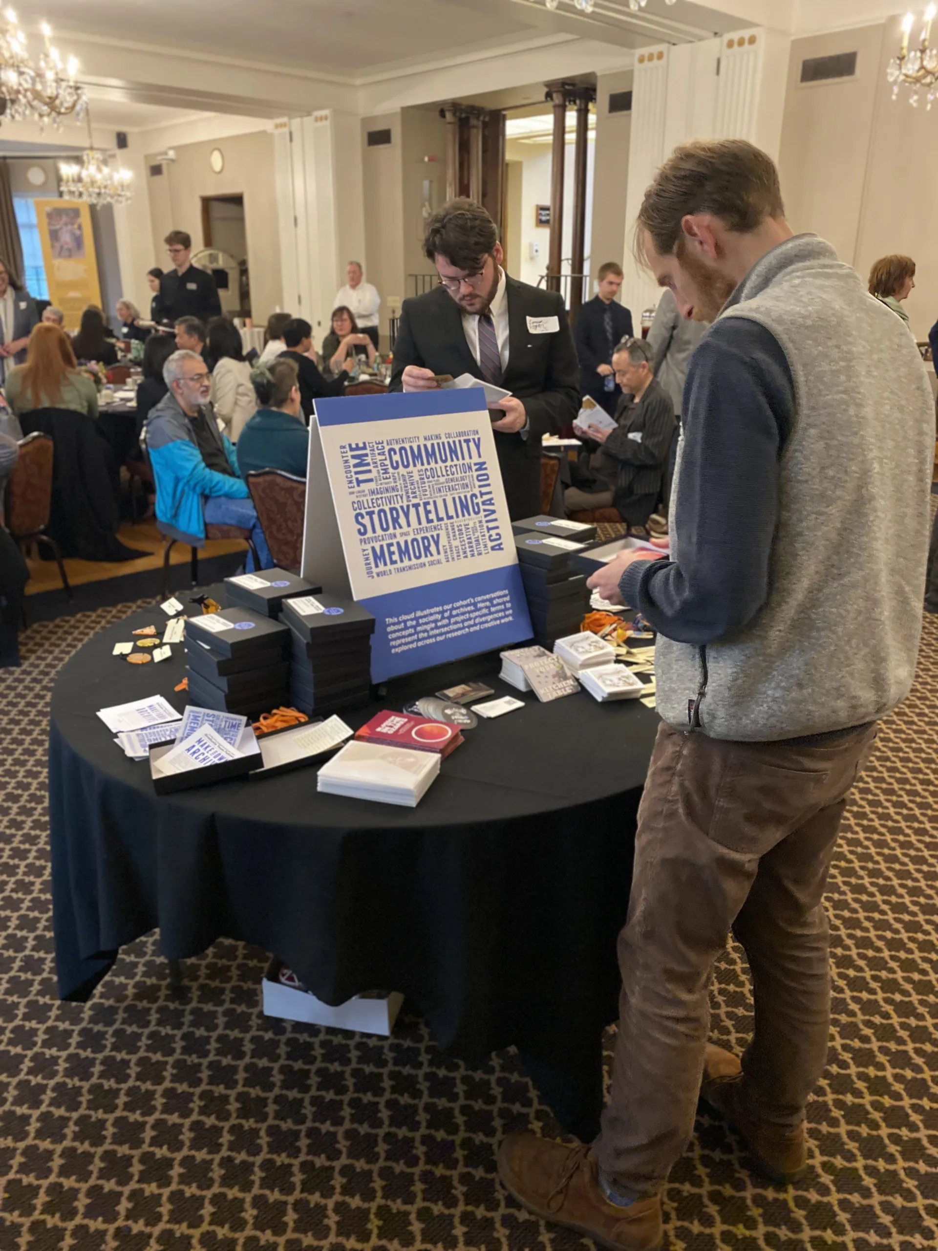 Event attendees engage with the exhibition