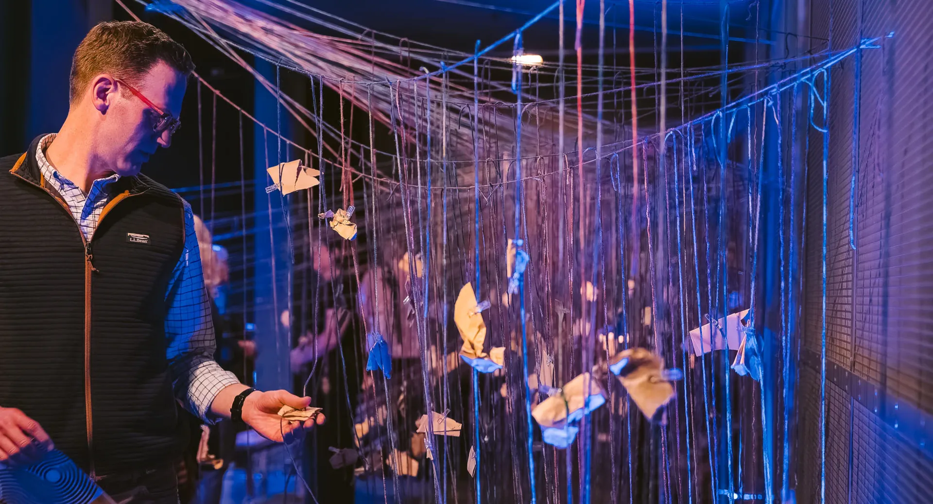 Person interacting with art installation