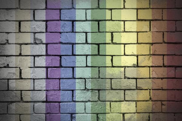 wall with lgbtq colors projected on it
