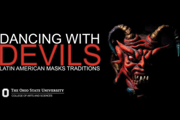 Photograph of Latin American devil mask against black background