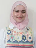 Smiling person wearing pink headscarf