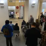 Audience watching performance on a screen