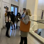 Attendees speaking with student fellows